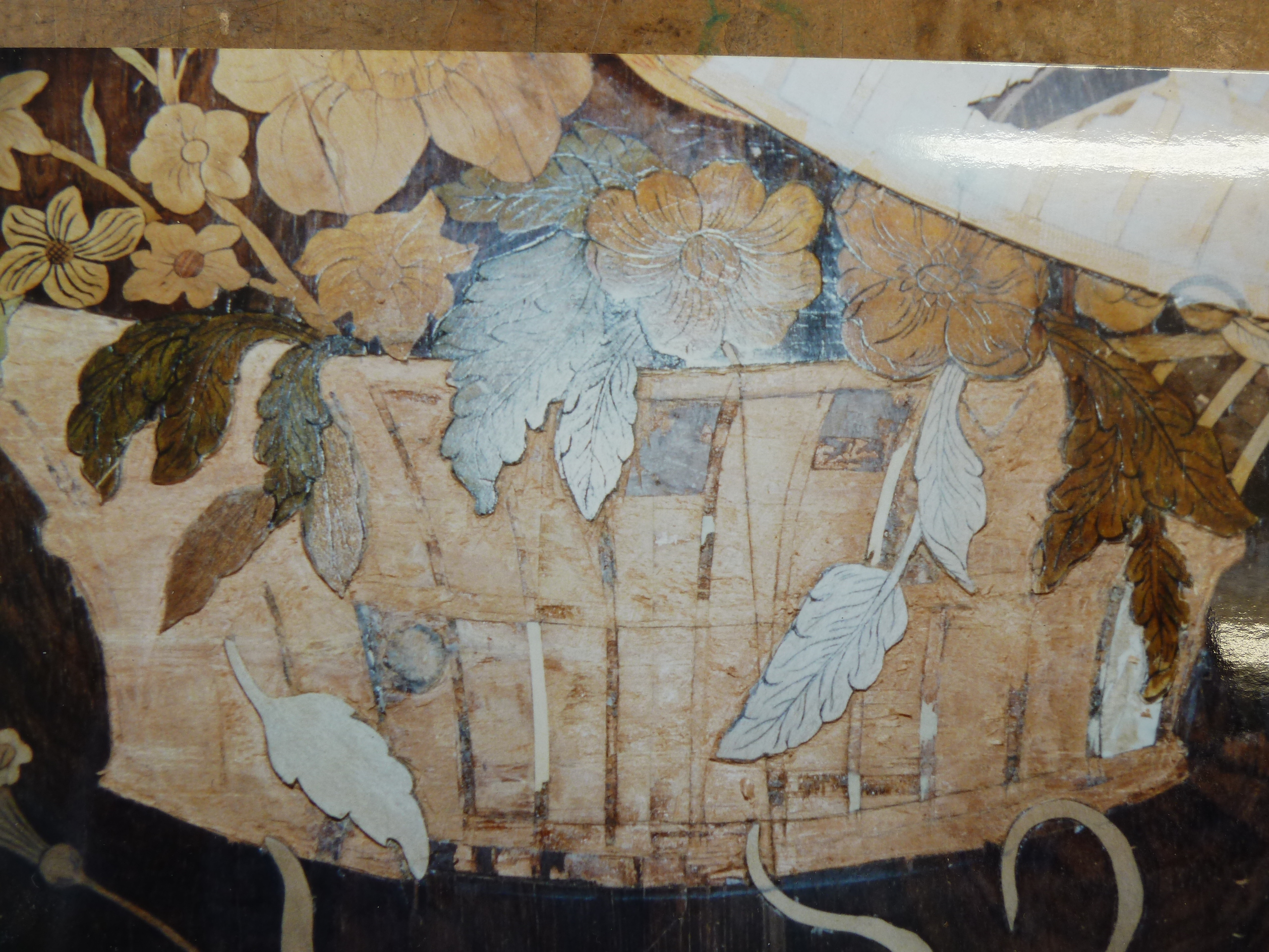 Restoration to marquetry with boxwood, satinwood, mahogany and tulip wood